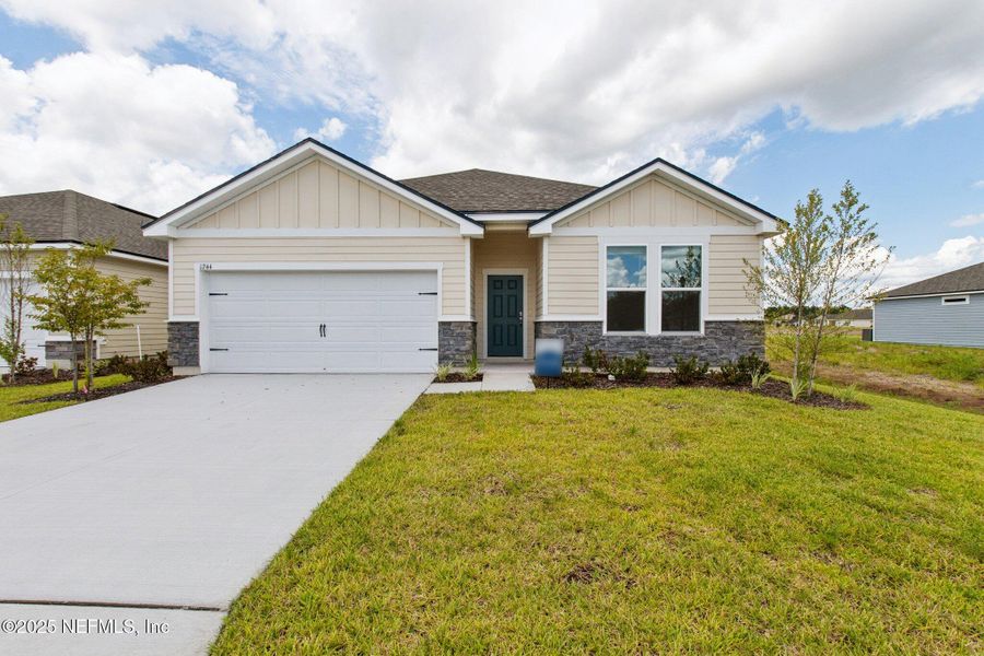 Front exterior of a new home in Panther Creek, Jacksonville, FL, highlighting curb appeal (Image 1). Front exterior of a new home in Panther Creek, Jacksonville, FL, highlighting curb appeal (Image 1).