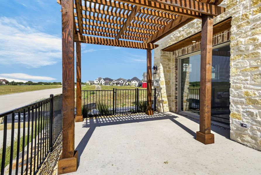 Exterior details and patio area of a home in The Tribute, The Colony (Image 28).