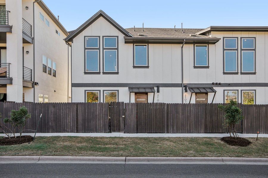 Exterior details and patio area of a home in Koenig Townhomes, Austin (Image 25).
