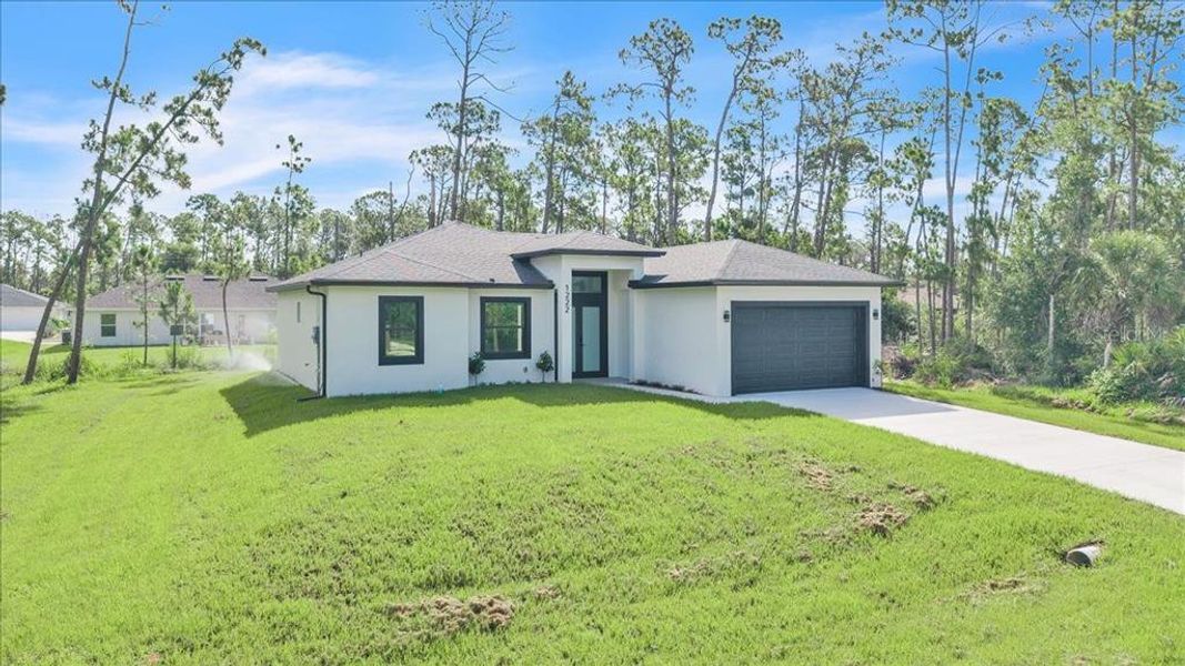Front exterior of a new home in , Port Charlotte, FL, highlighting curb appeal (Image 25). Front exterior of a new home in , Port Charlotte, FL, highlighting curb appeal (Image 25).