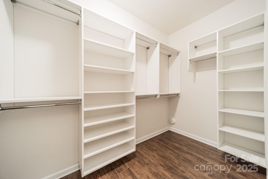 1 of the 2 Custom Primary Walk-in Closets 1 of the 2 Custom Primary Walk-in Closets