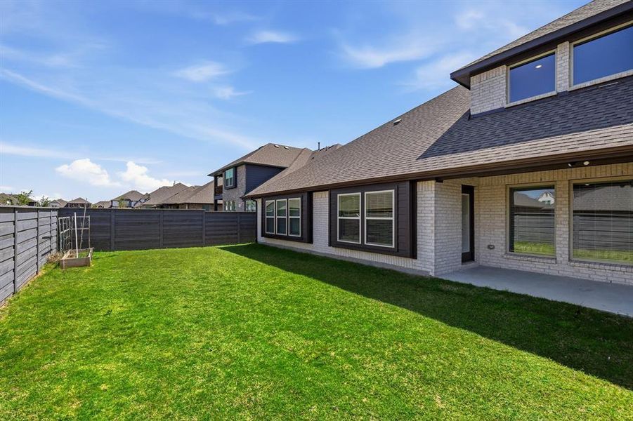 Exterior details and patio area of a home in Union Park, Little Elm (Image 4). Exterior details and patio area of a home in Union Park, Little Elm (Image 4).