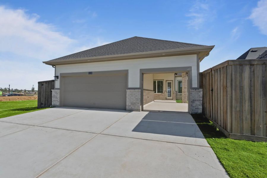 Representative exterior photo of a completed home built from the Mickelson by Chesmar Homes in Riceland Alley Loads, Mont Belvieu, TX (Image 34).
