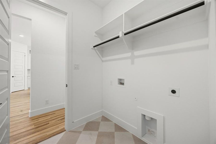Laundry area featuring hookup for a washing machine, light floors, hookup for an electric dryer, and gas dryer hookup