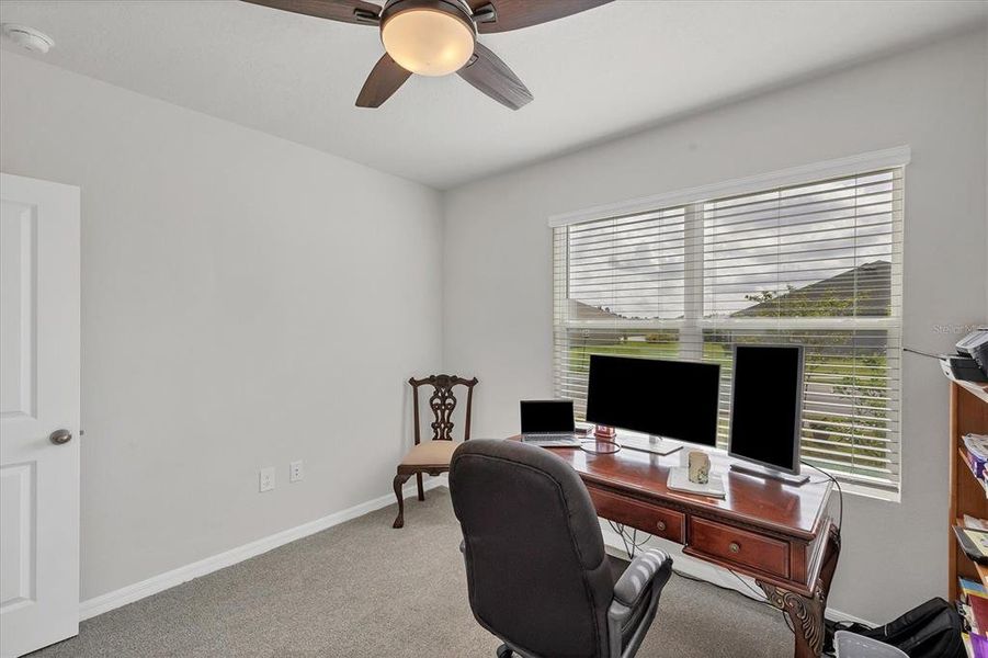 Bedroom #1 facing street setup as office