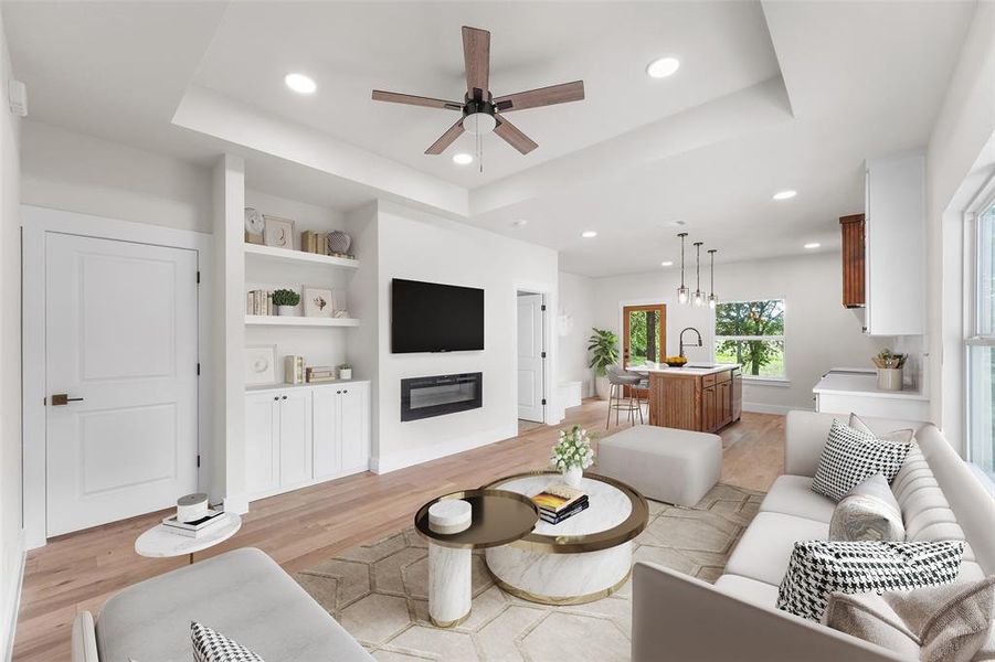 Open-concept living space featuring wood-finish flooring, recessed lighting, and a modern ceiling fan
