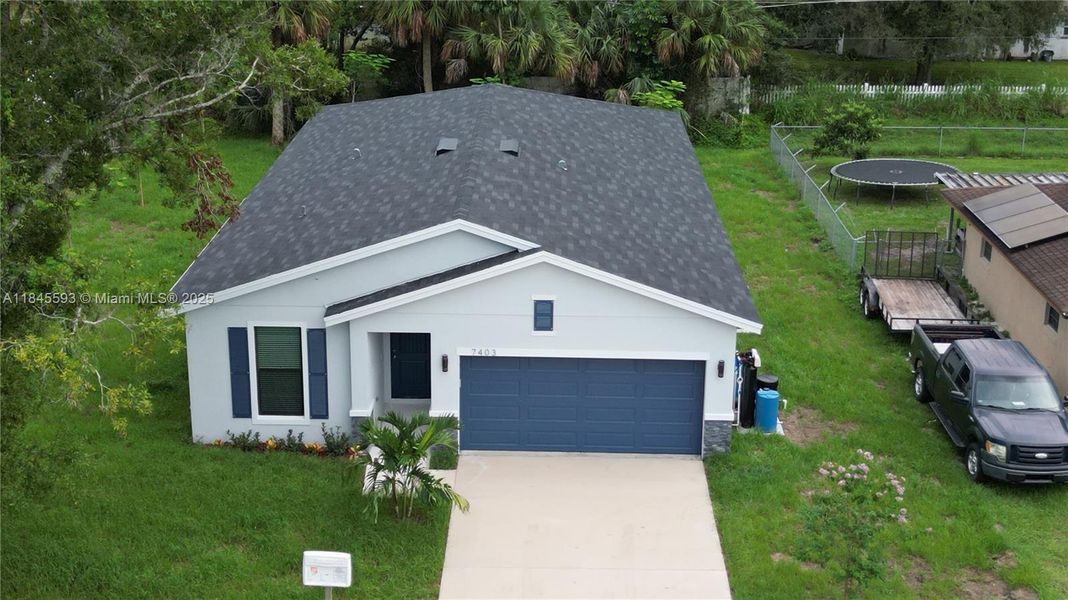 Front exterior of a new home in , Fort Pierce, FL, highlighting curb appeal (Image 1). Front exterior of a new home in , Fort Pierce, FL, highlighting curb appeal (Image 1).
