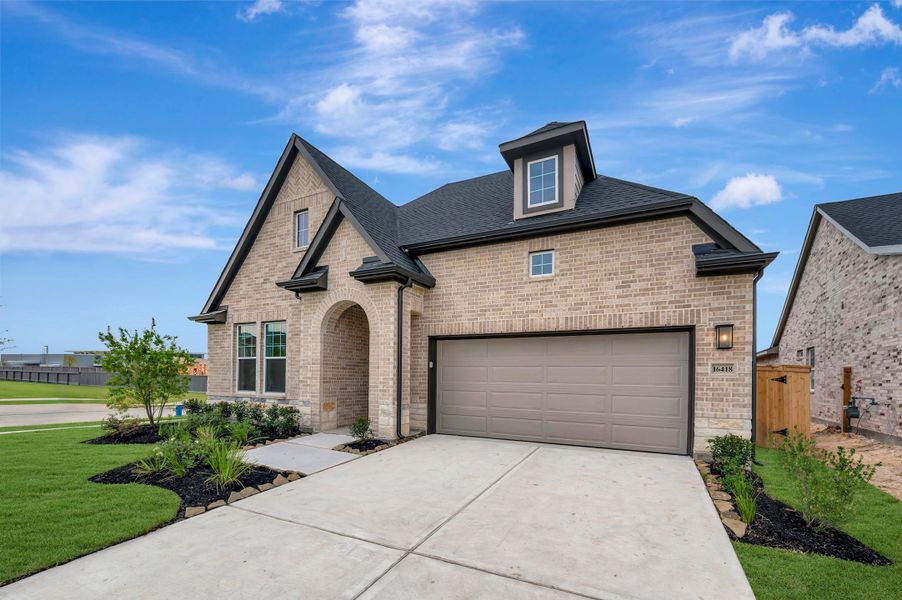 Front exterior of a new home in The Grand Prairie - Retreat Collection, Hockley, TX, highlighting curb appeal (Image 27).