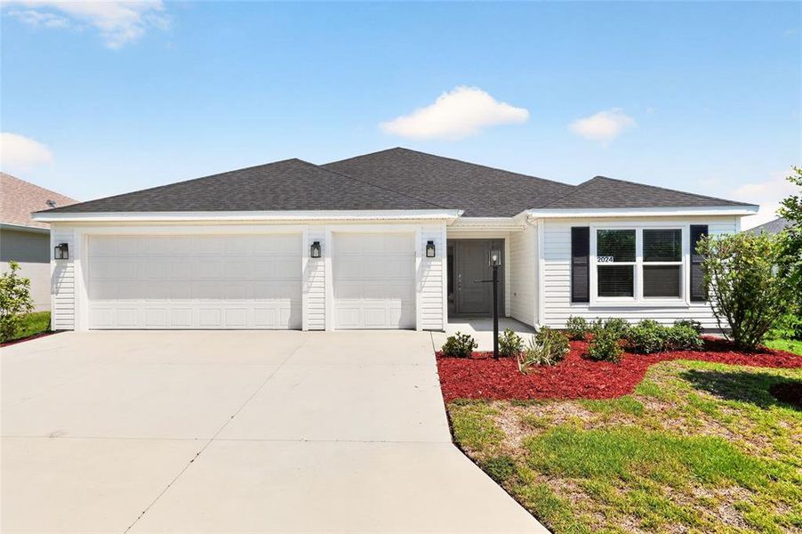 Front exterior of a new home in , The Villages, FL, highlighting curb appeal (Image 28).