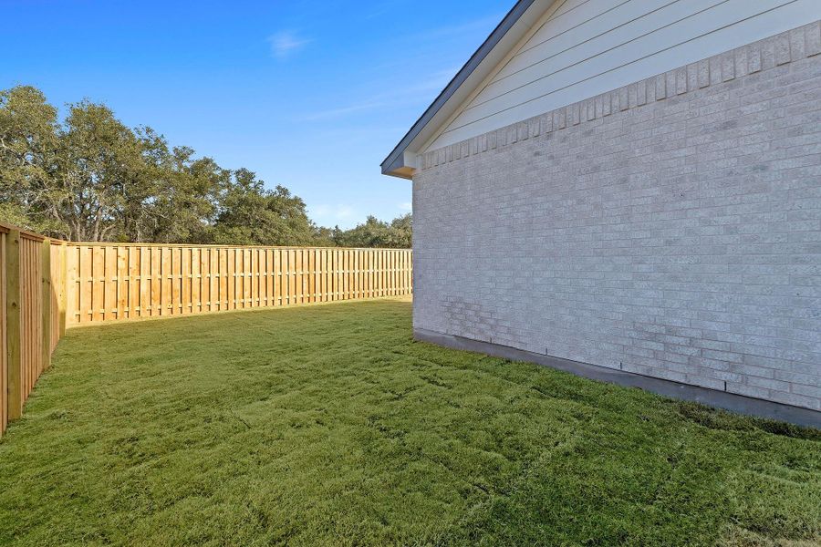 Exterior details and patio area of a home in Parmer Ranch, Georgetown (Image 23).