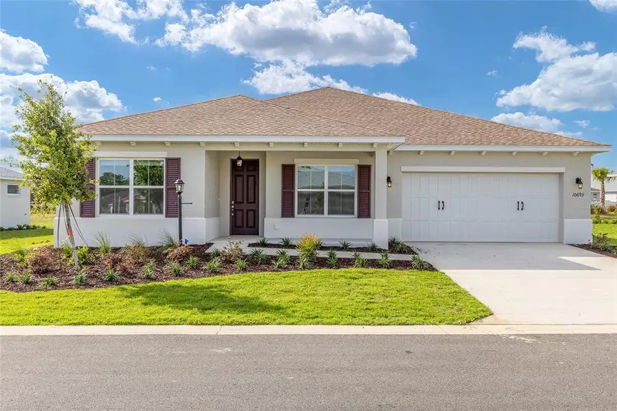 Front exterior of a new home in , Ocala, FL, highlighting curb appeal (Image 20).