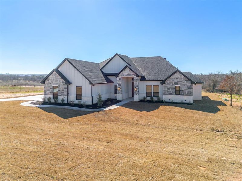 Front exterior of a new home in , Weatherford, TX, highlighting curb appeal (Image 26).