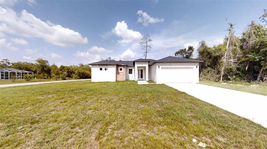 Front exterior of a new home in , Ocala, FL, highlighting curb appeal (Image 2).
