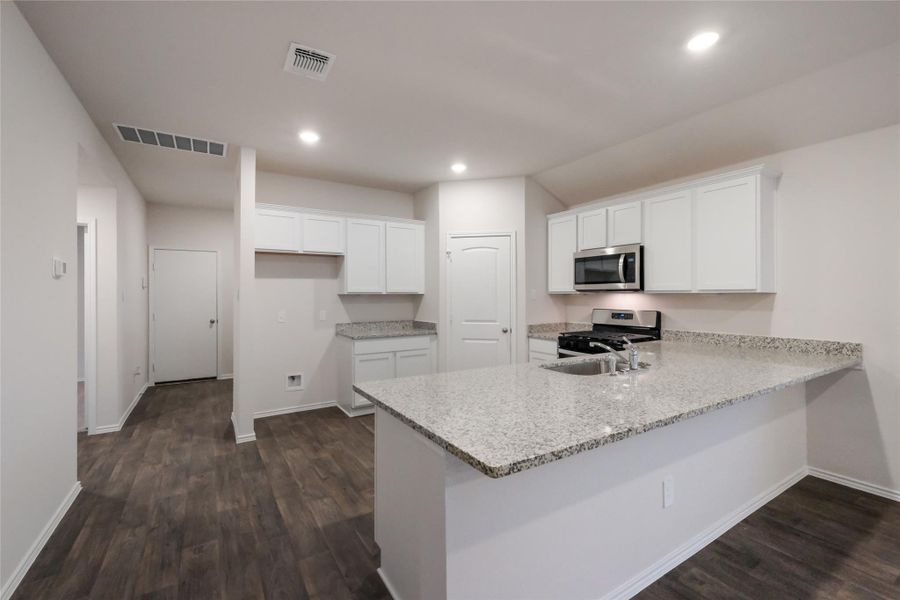 Furnished interior view inside a new home in Watermill, Uhland (Image 5).