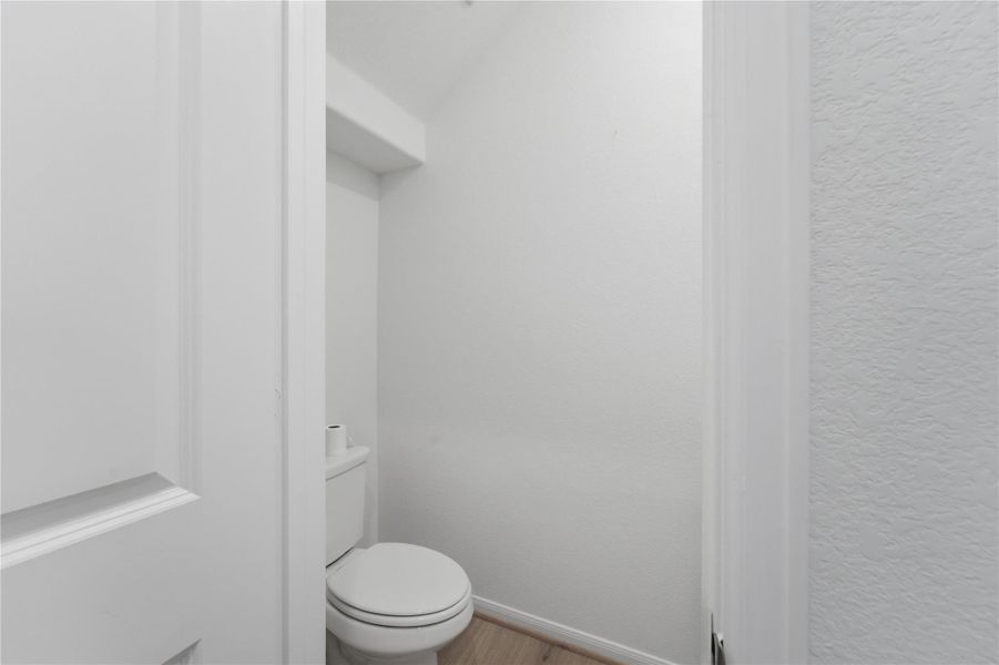 Minimalist powder room featuring clean lines and a functional layout. Minimalist powder room featuring clean lines and a functional layout.
