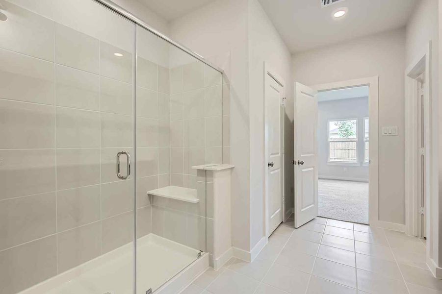 A bathroom with a glass shower.
