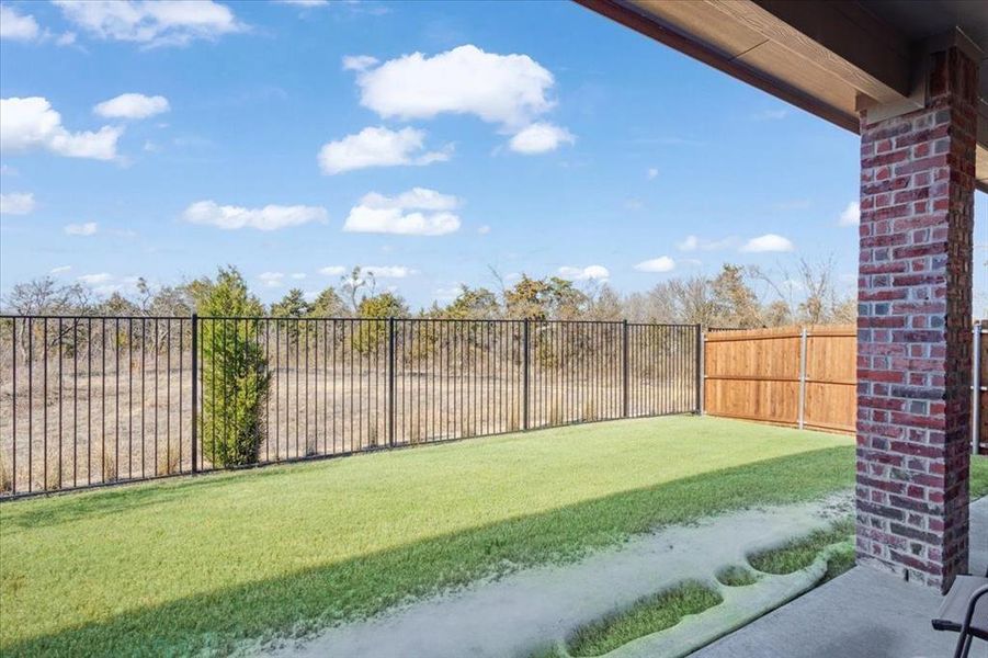 Exterior details and patio area of a home in Hurricane Creek, Anna (Image 27).