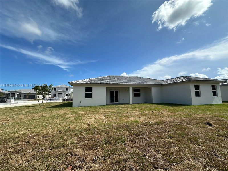 Exterior details and patio area of a home in Hawthorne at Galiano Pointe, Miami (Image 17).