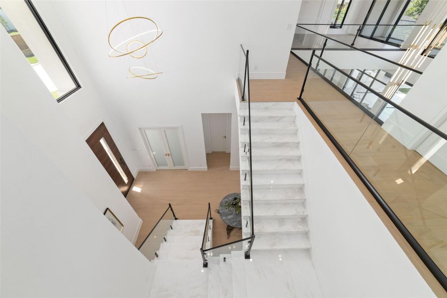 Upstairs, a spacious game room creates a second destination for gathering.
