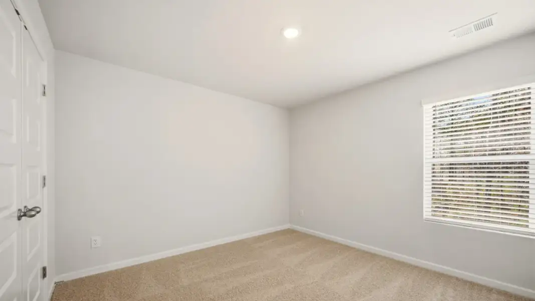 Representative unfurnished interior of a home built from the Somerset by D.R. Horton in Branford Crossing, Stockbridge (Image 19).