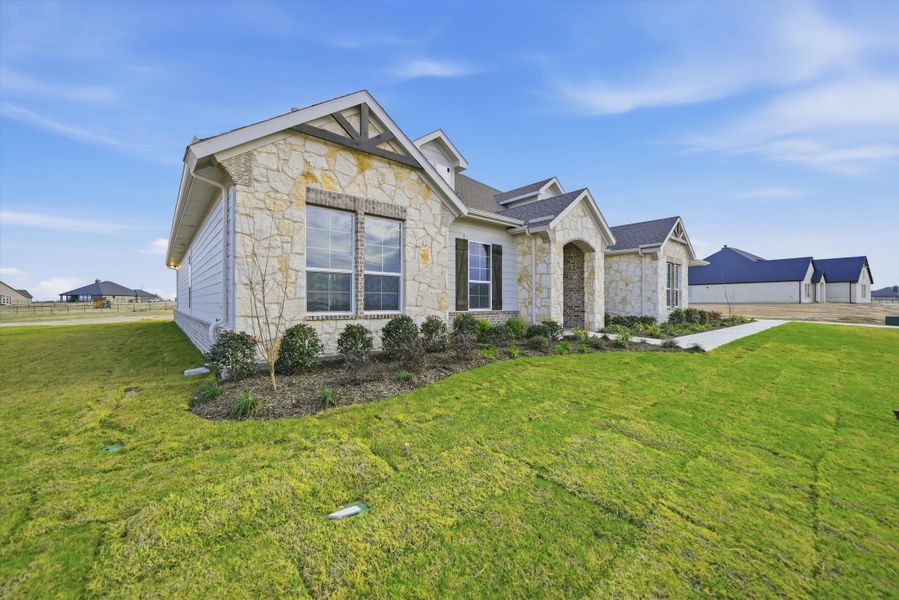 Front exterior of a new home in Eagle Ridge Estates, Weatherford, TX, highlighting curb appeal (Image 20).