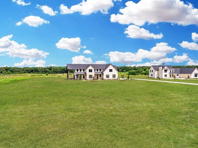 Front exterior of a new home in , Wills Point, TX, highlighting curb appeal (Image 25). Front exterior of a new home in , Wills Point, TX, highlighting curb appeal (Image 25).