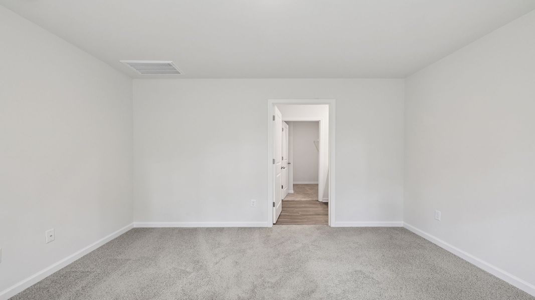 Spacious, unfurnished interior of a new home in Bentley Park, Greenwood (Image 25).
