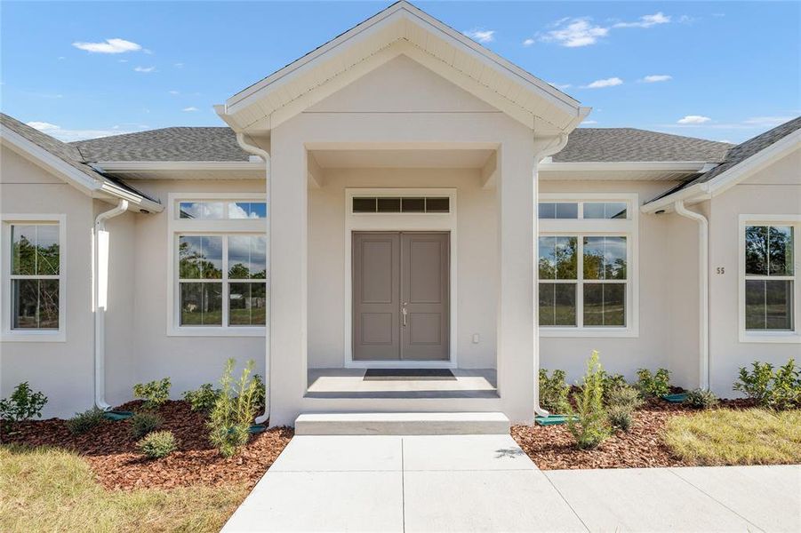 Front exterior of a new home in , Debary, FL, highlighting curb appeal (Image 32). Front exterior of a new home in , Debary, FL, highlighting curb appeal (Image 32).