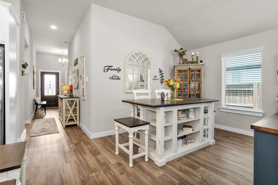A view of the dining room and entry hall. Love the architectural detail of the wall/ceiling here giving character to the space. A view of the dining room and entry hall. Love the architectural detail of the wall/ceiling here giving character to the space.