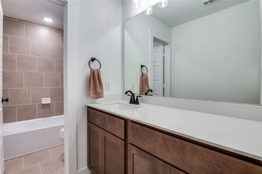Furnished interior view inside a new home in Prairie Ridge at Goodland, Venus (Image 21).