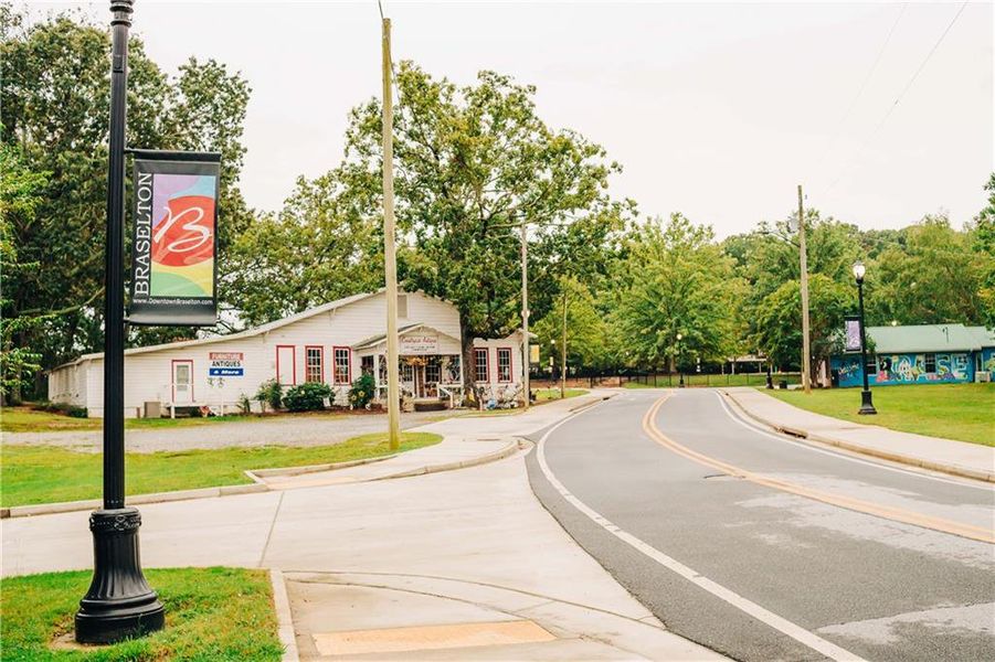 Front exterior of a new home in Rosewood Lake Estates, Hoschton, GA, highlighting curb appeal (Image 76).