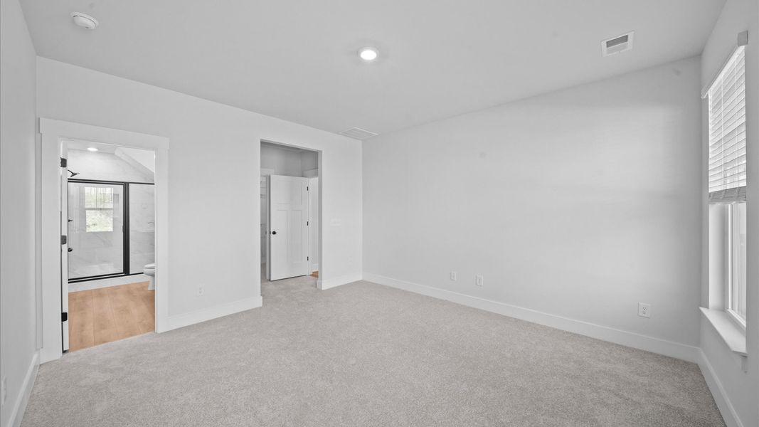 Accomplished design meets restful elegance in this exclusive primary suite by DRB Homes