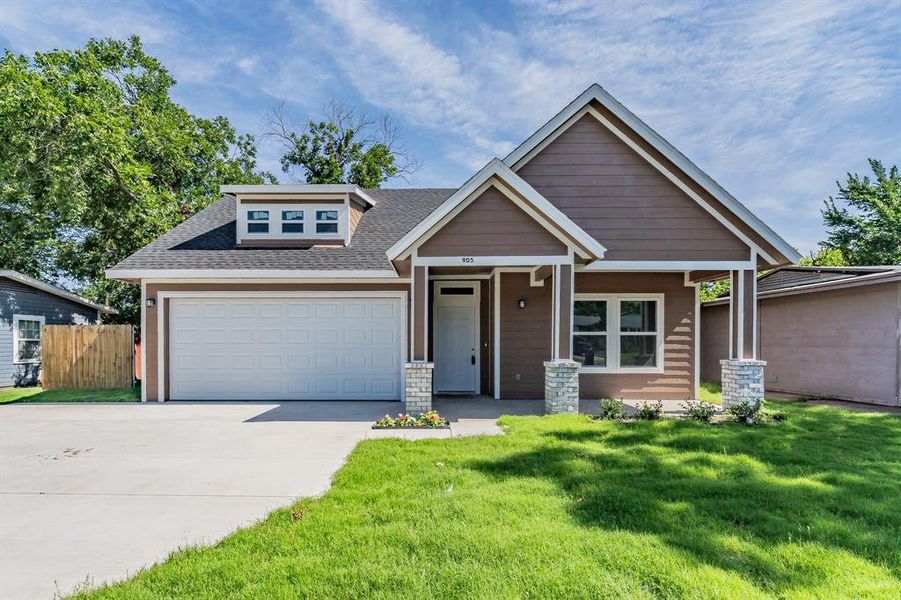 View of front of house with concrete driveway, an attached garage, roof with shingles, and covered porch View of front of house with concrete driveway, an attached garage, roof with shingles, and covered porch