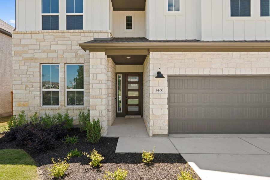 Exterior details and patio area of a home in Lariat, Liberty Hill (Image 3).