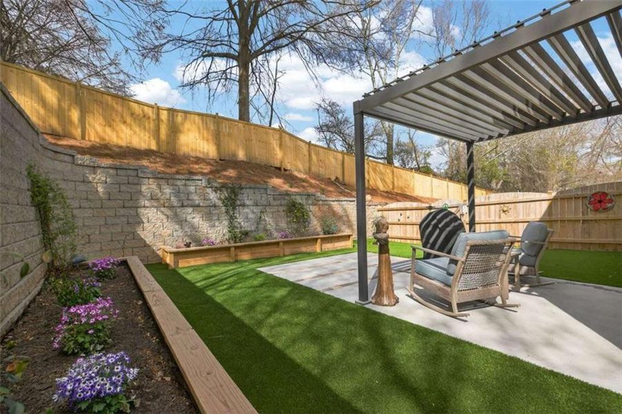 Exterior details and patio area of a home in The Village at Towne Lake, Woodstock (Image 26).
