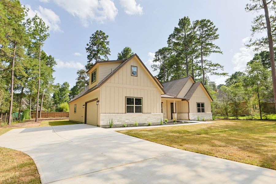Front exterior of a new home in , Magnolia, TX, highlighting curb appeal (Image 24).