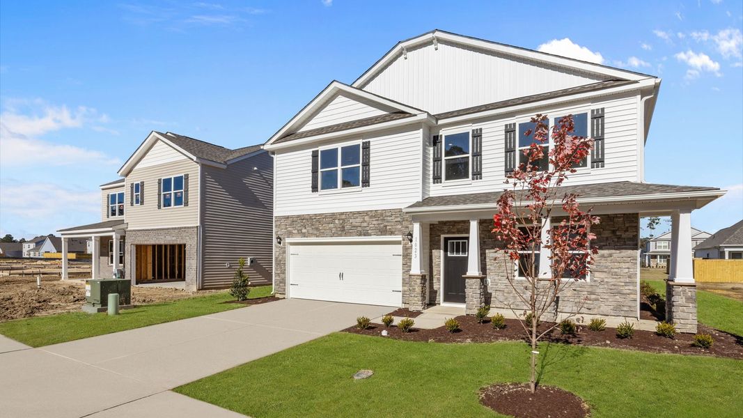 Front exterior of a new home in West New Bern, New Bern, NC, highlighting curb appeal (Image 20). Front exterior of a new home in West New Bern, New Bern, NC, highlighting curb appeal (Image 20).