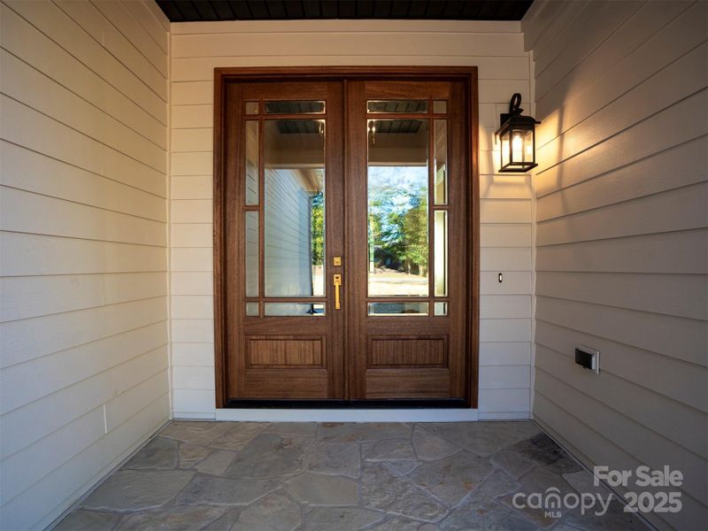 Beautiful glass front entry with flagstone porch Beautiful glass front entry with flagstone porch