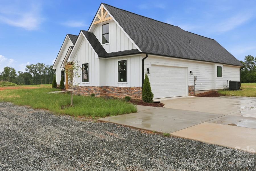 Front exterior of a new home in , Locust, NC, highlighting curb appeal (Image 2). Front exterior of a new home in , Locust, NC, highlighting curb appeal (Image 2).