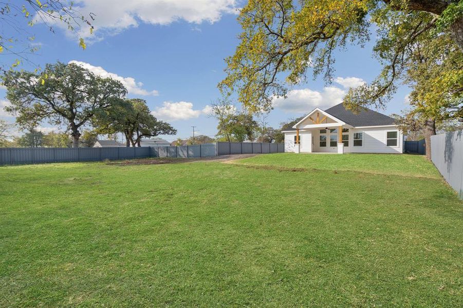 View of fenced backyard