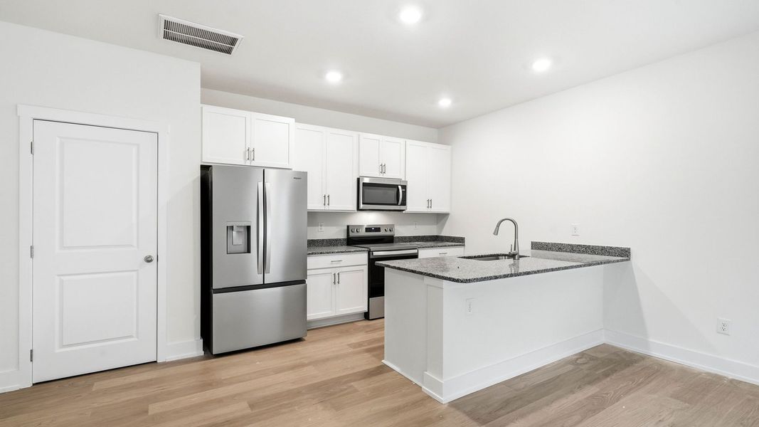 Furnished interior view inside a new home in Macon Townhomes, Seymour (Image 6).
