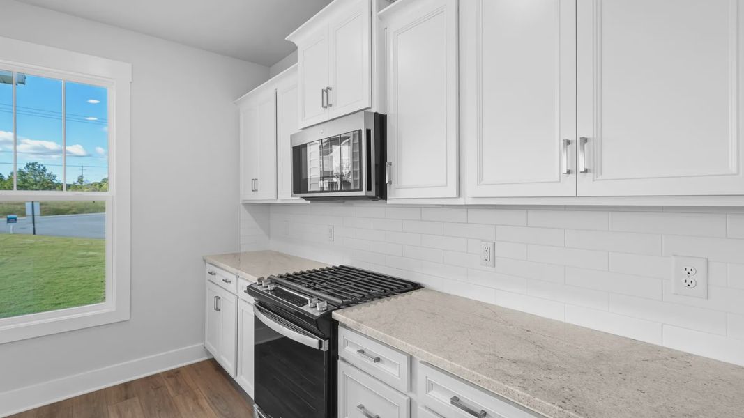 2 story single family home, all white, kitchen