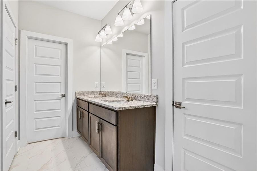 Furnished interior view inside a new home in The Fairways at Mirror Lake, Villa Rica (Image 8).