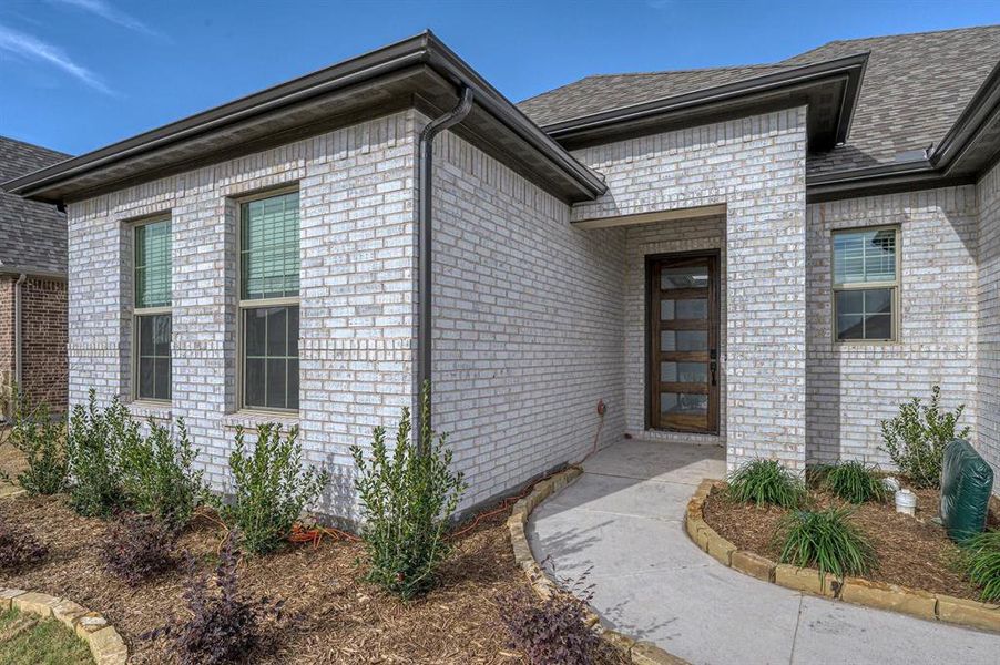 Exterior details and patio area of a home in Estates At Baker Park, Sherman (Image 3).