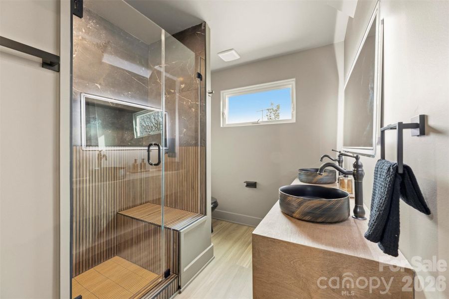 Beautifully finished bath with modern styling and thoughtful design details