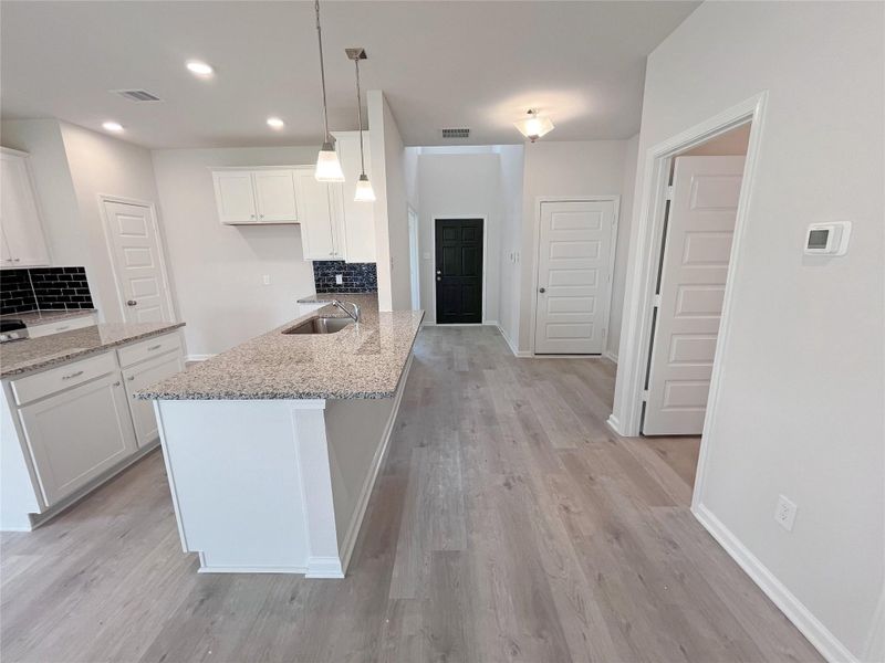 The Georgetown II- Kitchen and Foyer. Sample image for illustration; upgrades, options, and colors may vary.