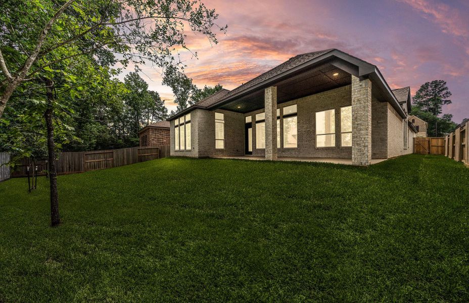 Exterior details and patio area of a home in The Woodlands Hills 65′, Willis (Image 29).