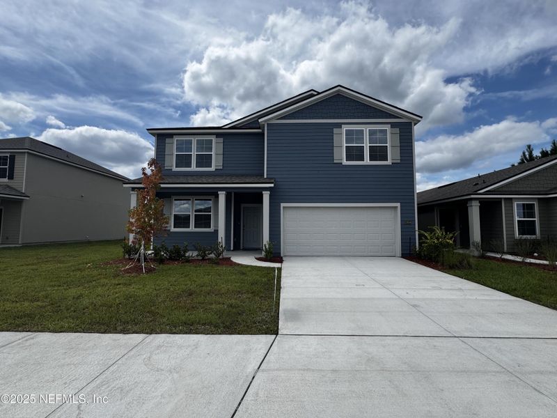 Front exterior of a new home in The Arbors, Jacksonville, FL, highlighting curb appeal (Image 31).