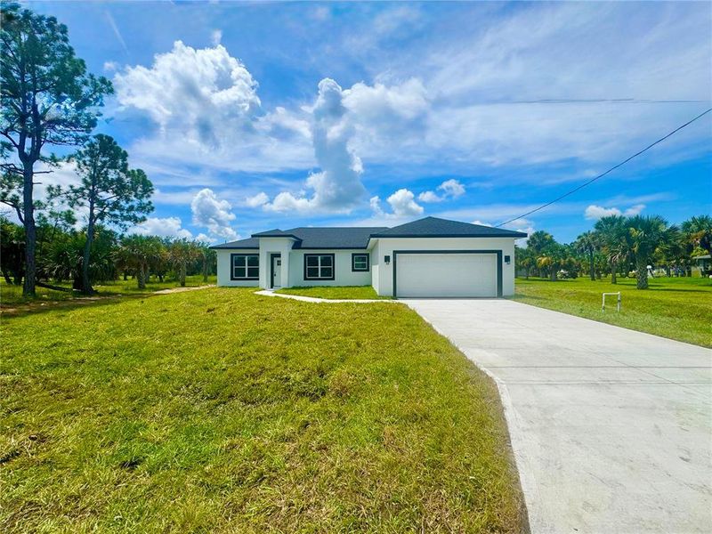Front exterior of a new home in , Palm Bay, FL, highlighting curb appeal (Image 23).