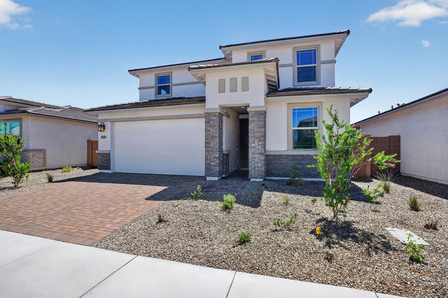 Front exterior of a new home in Artisan at Asante, Surprise, AZ, highlighting curb appeal (Image 20).